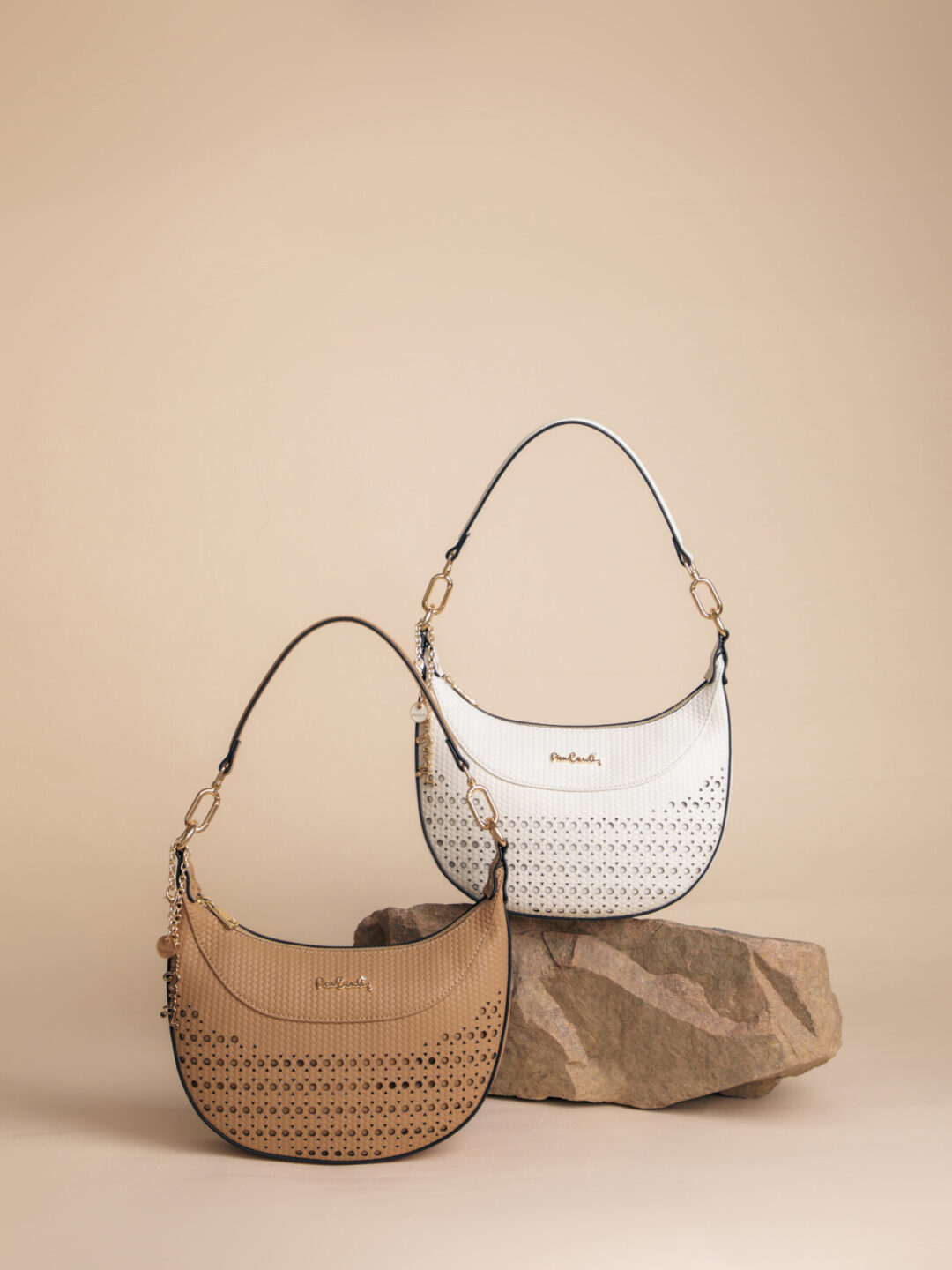 a group of purses on a rock