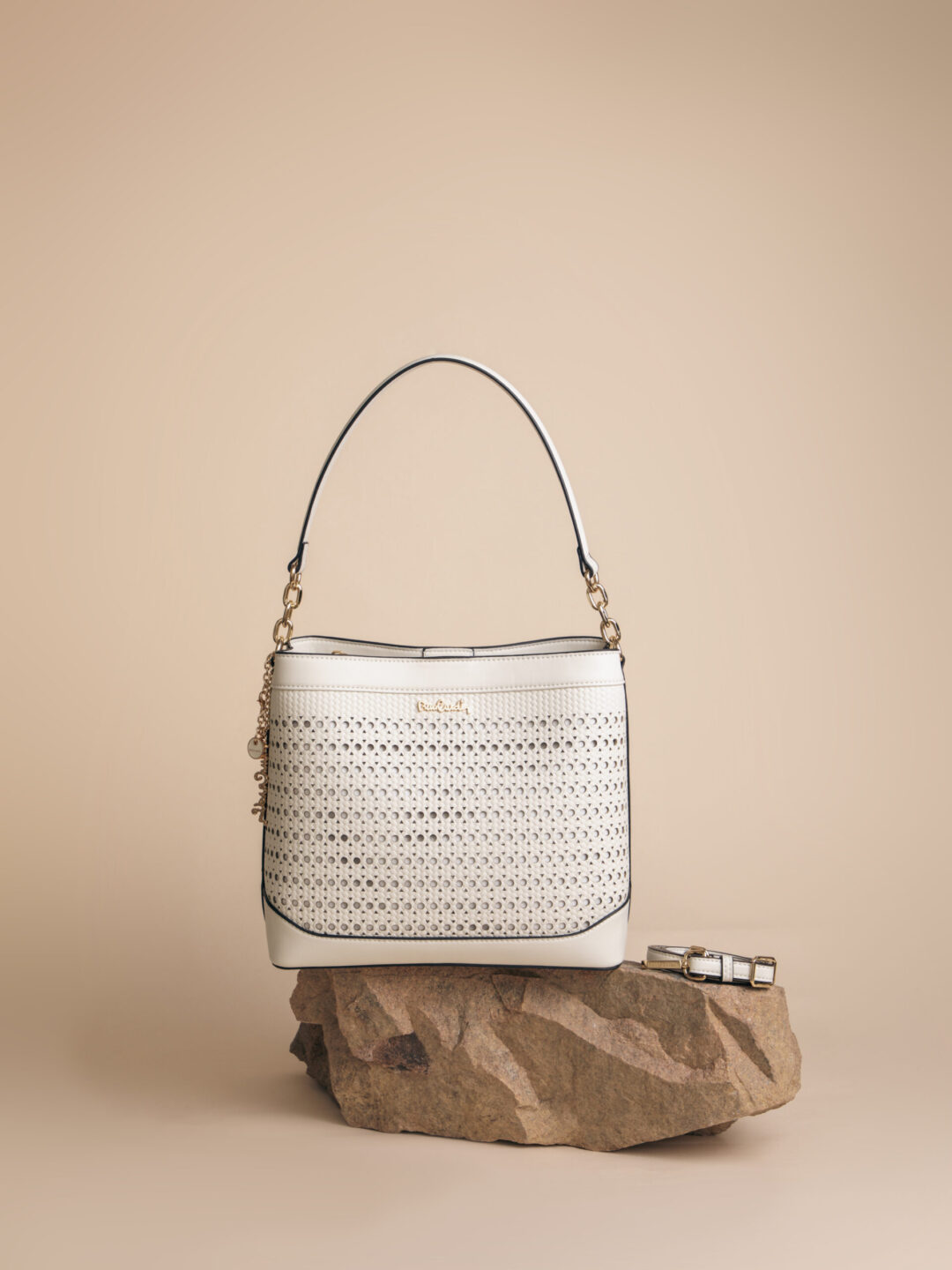 a white purse on a rock