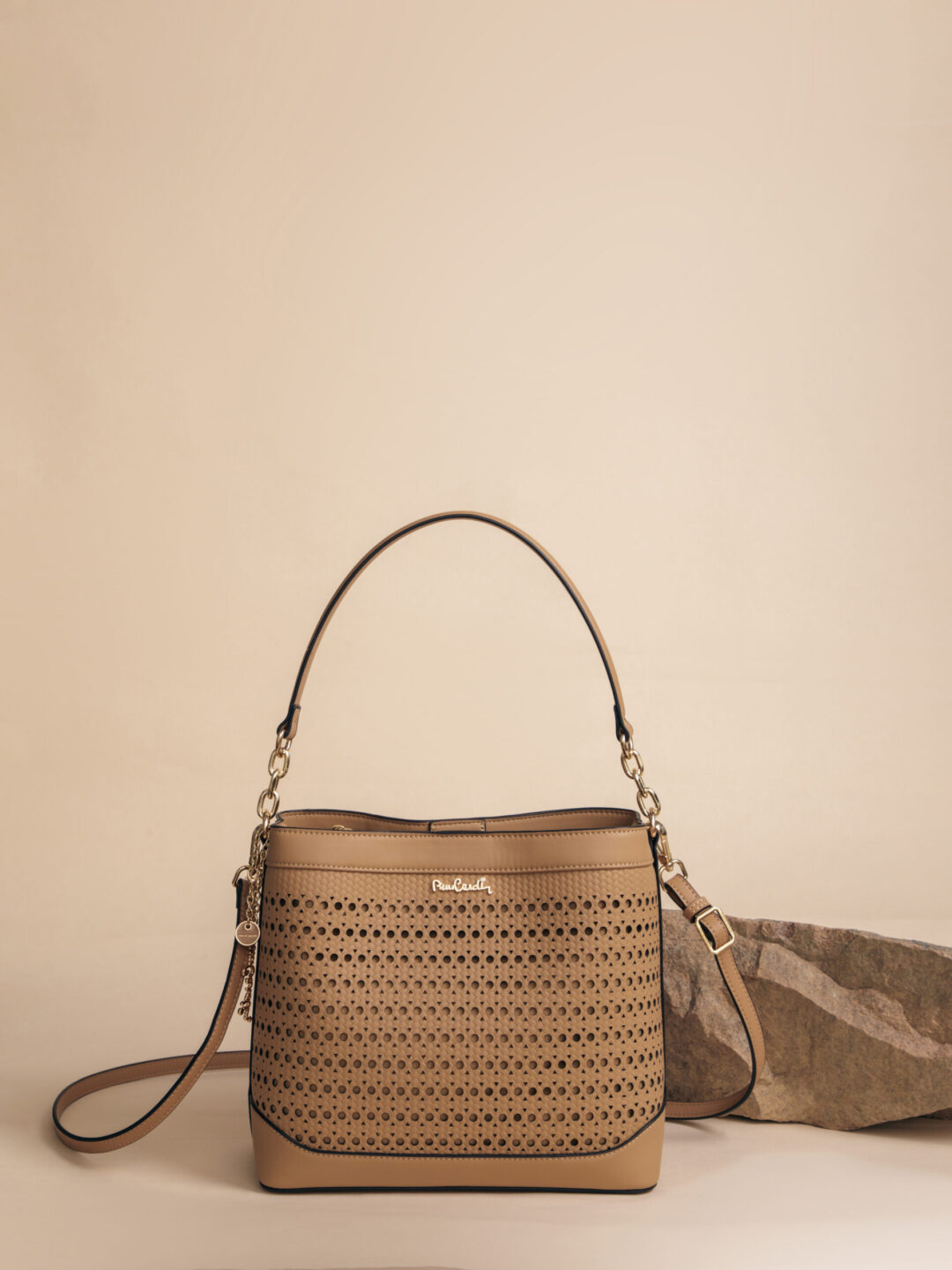 a brown purse with a scarf